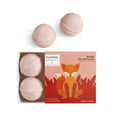A bath bomb kit for kids featuring four pink, citrus-scented bath bombs and a colorful box with a fox illustration, handmade by Humble Botanics.