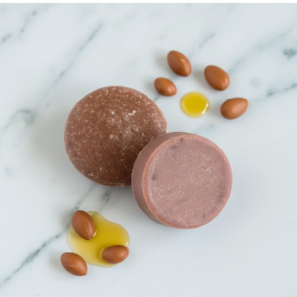 A sustainable duo bundle featuring Argan Oil shampoo and conditioner bars for hair repair and frizz control