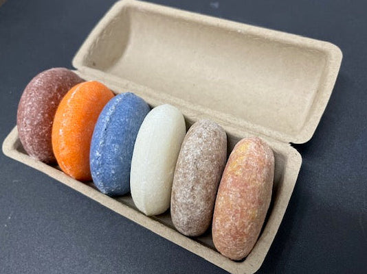 Angled view of the plastic-free variety bundle featuring 6 different natural scents.